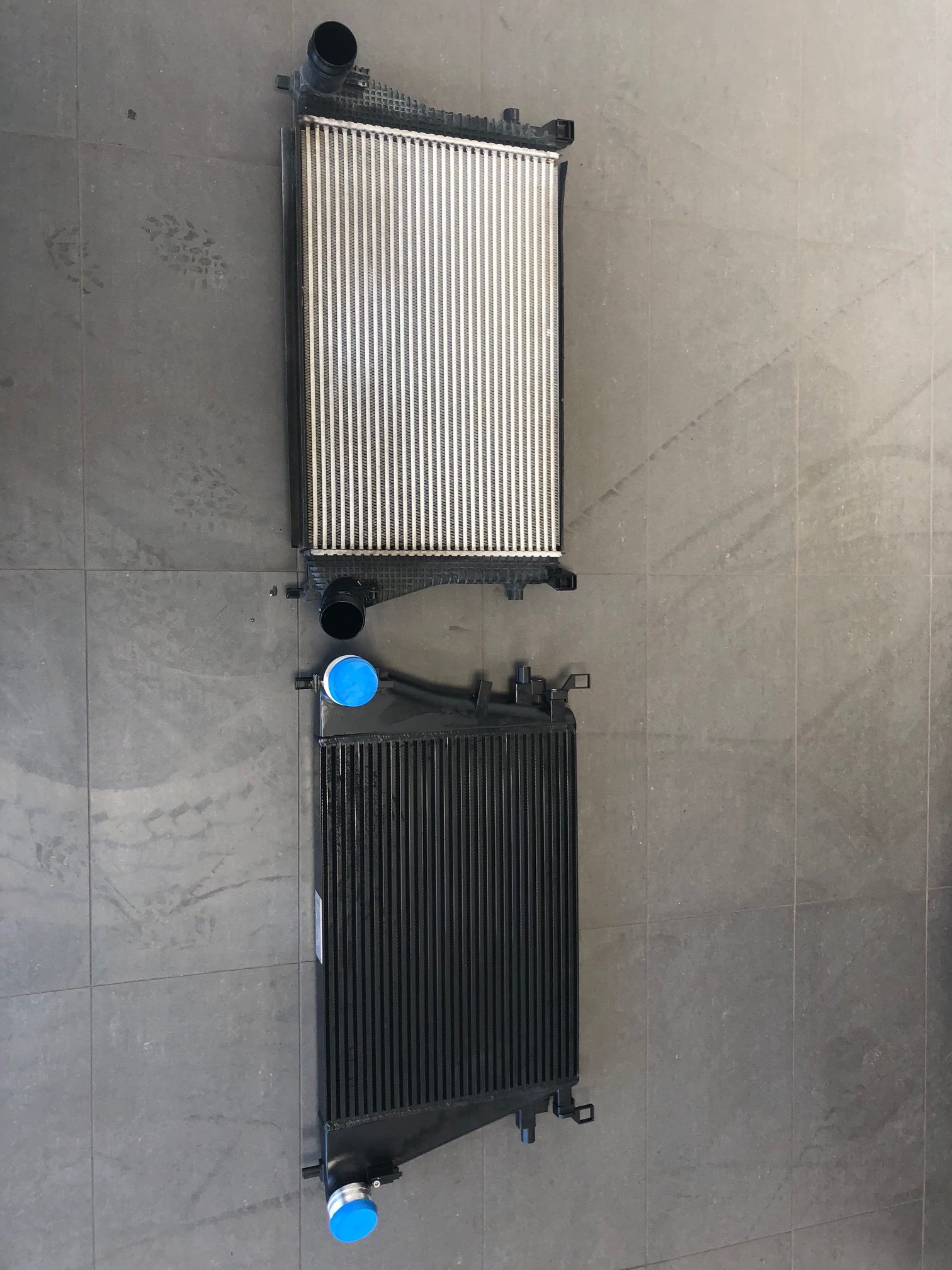 A bathroom with a walk in shower
Description automatically generated