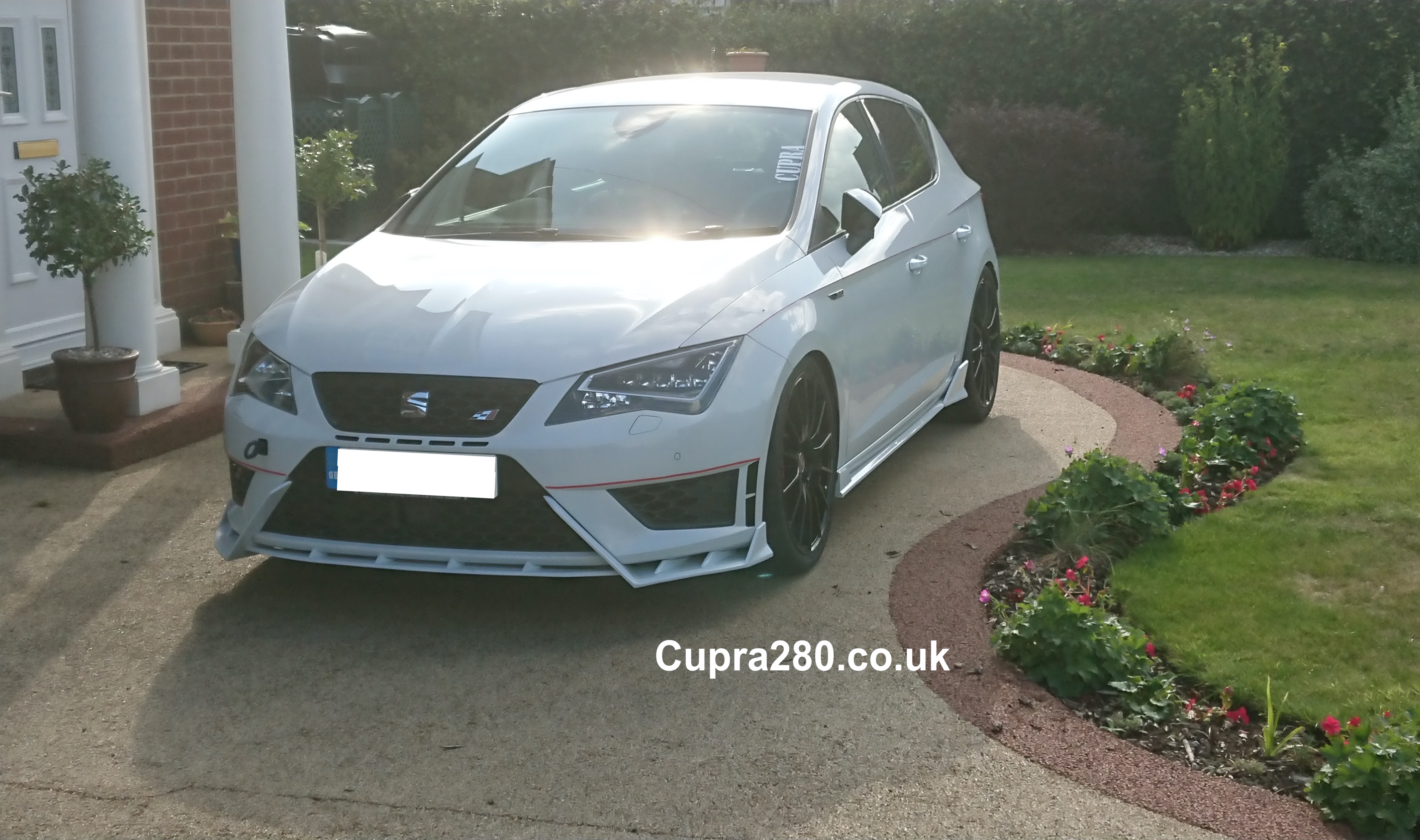 A car parked on the side of a road
Description automatically generated