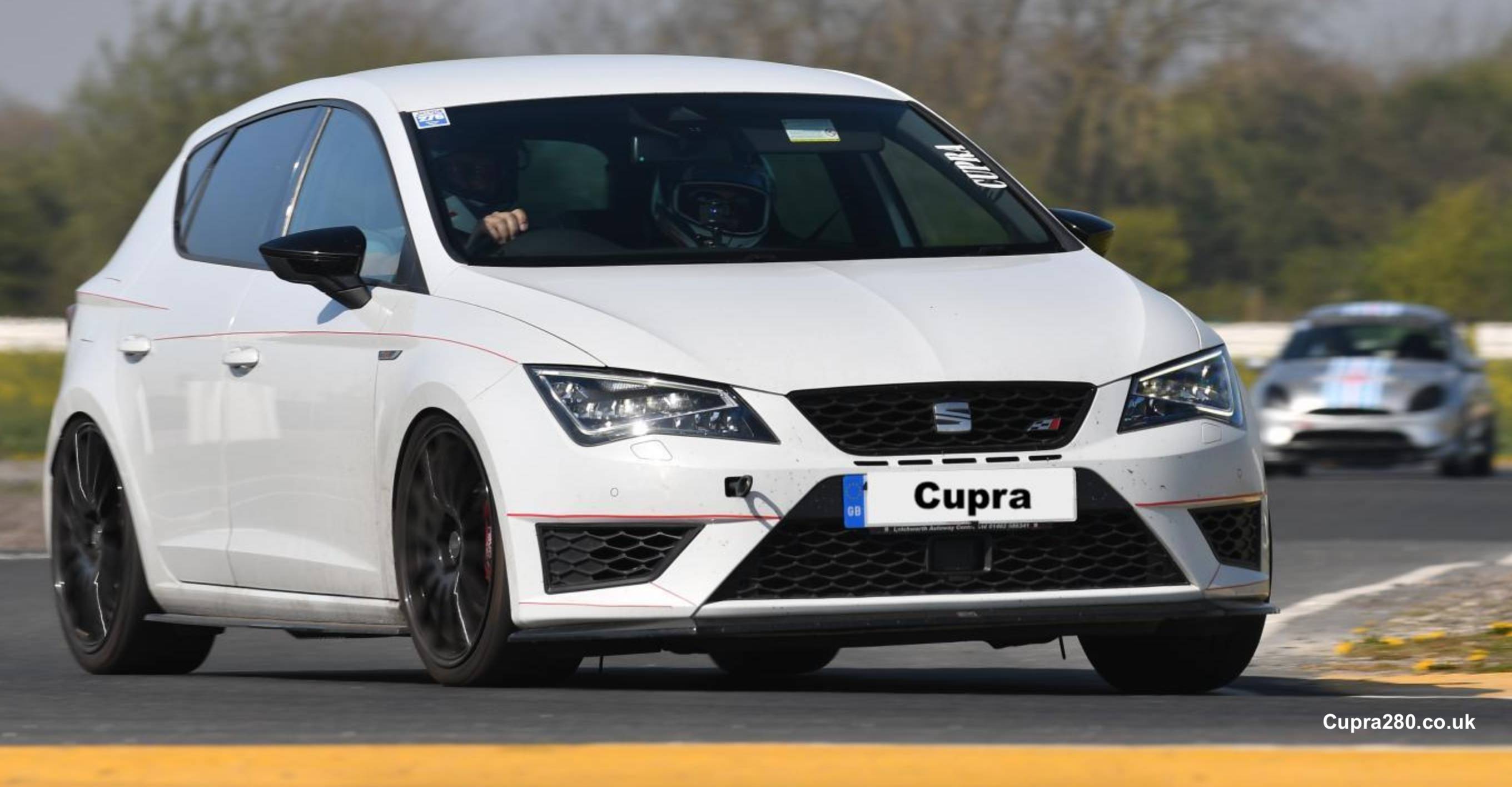 A police car on the road
Description automatically generated