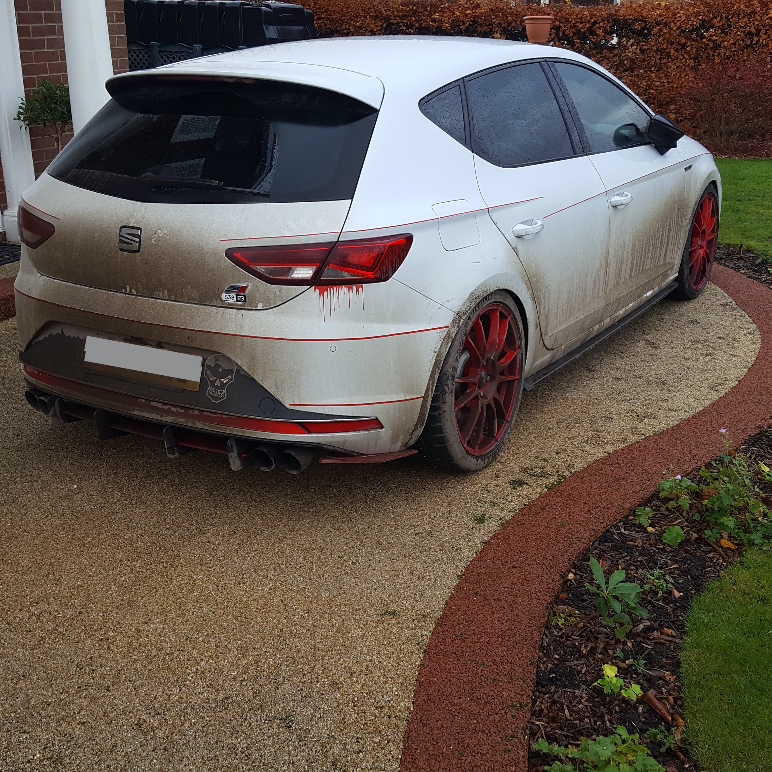 A car parked in a parking lot
Description automatically generated