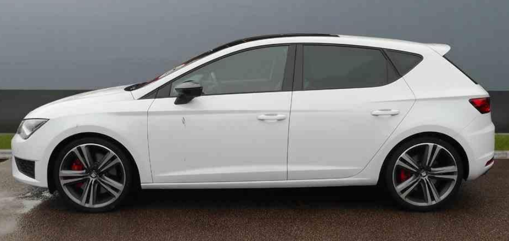 A white car parked on a road
Description automatically generated with low confidence